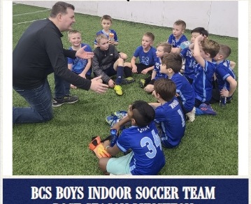 Jason coaching youth soccer