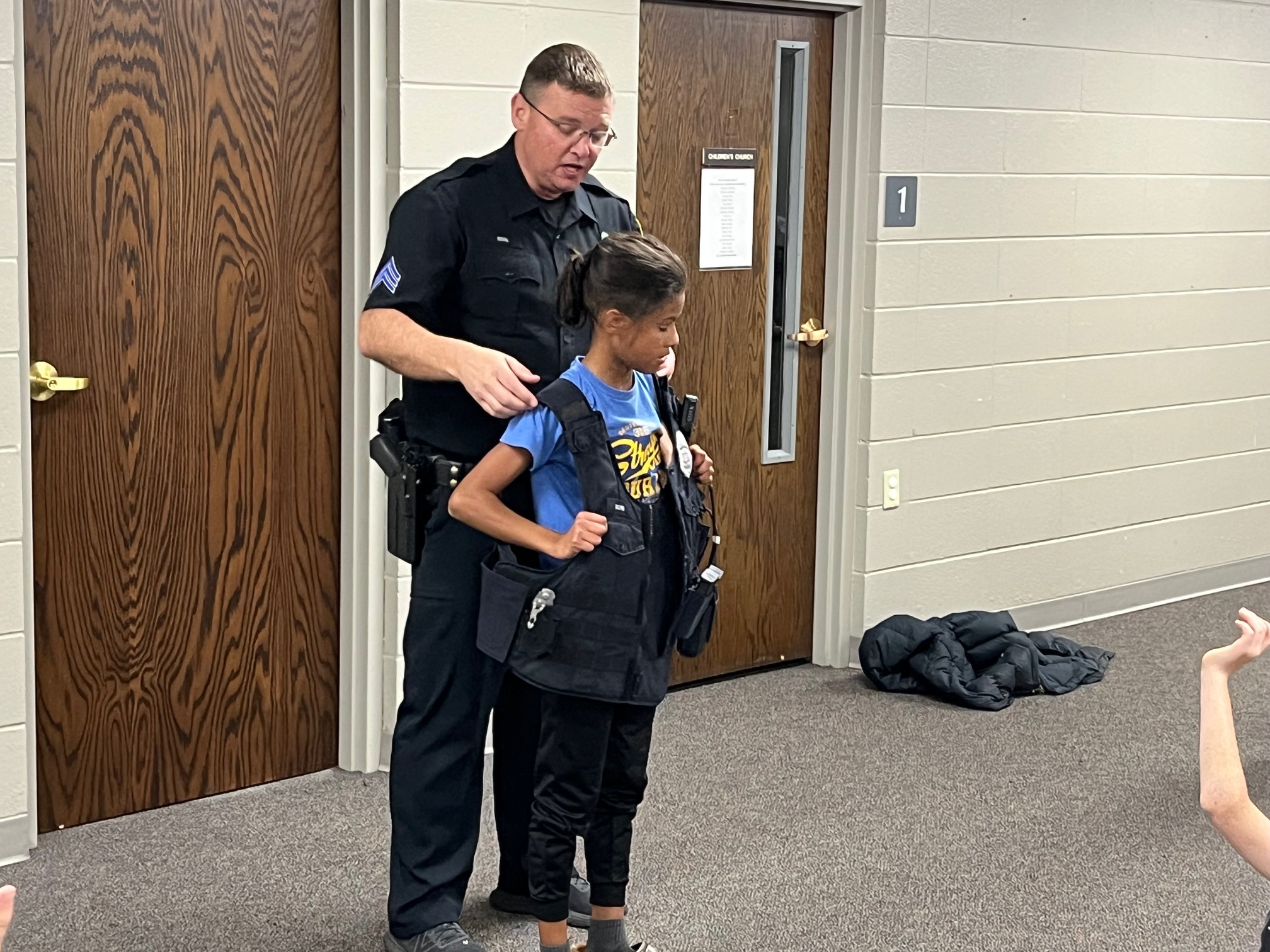 Police officer with child at Boys Club
